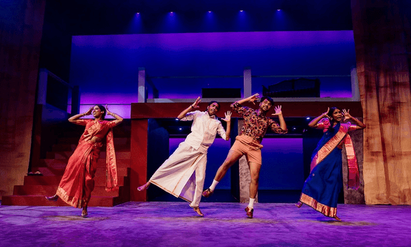 a blue stage with characters dancin, all leaning to the side with a shadowy blue light from the theatre behind them