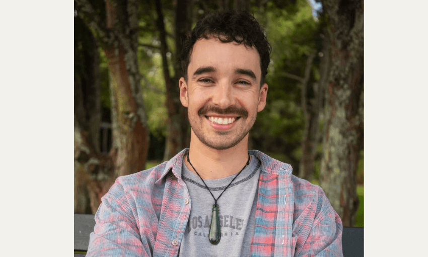 Director Joe Canham smiles directly at the camera. 