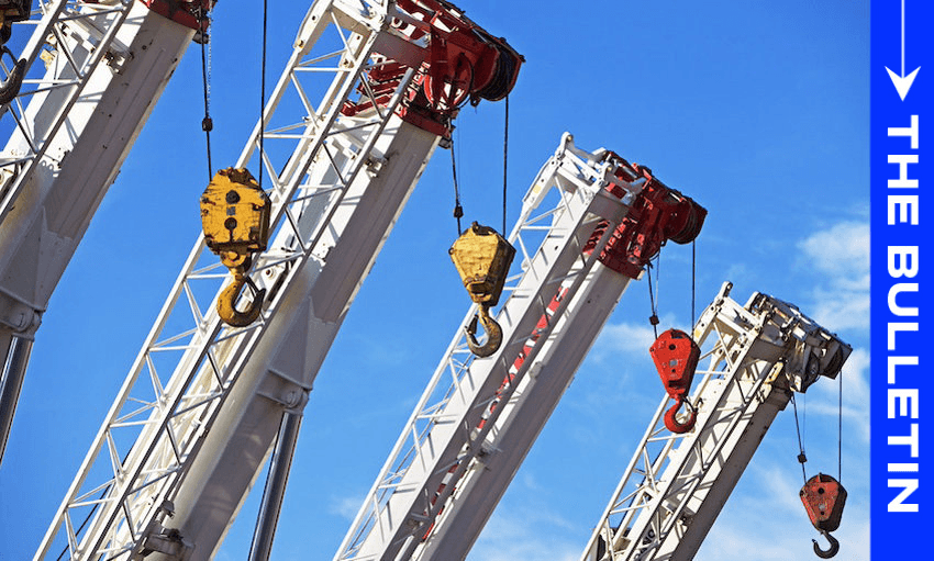 A row of construction crane arms with hooks extends diagonally against a blue sky. The crane arms are angled towards the upper right corner. A blue vertical banner on the right side reads "The Bulletin.
