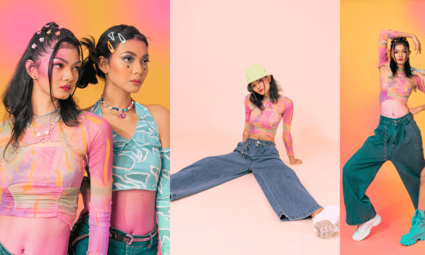 two young women wearing colour ful mwesh clothing, loose jeans, bucket hat and lots of plastic bright hairclips