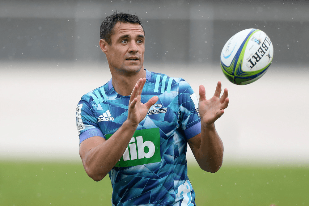 dan carter catching a rugby ball wearing a blues jersey