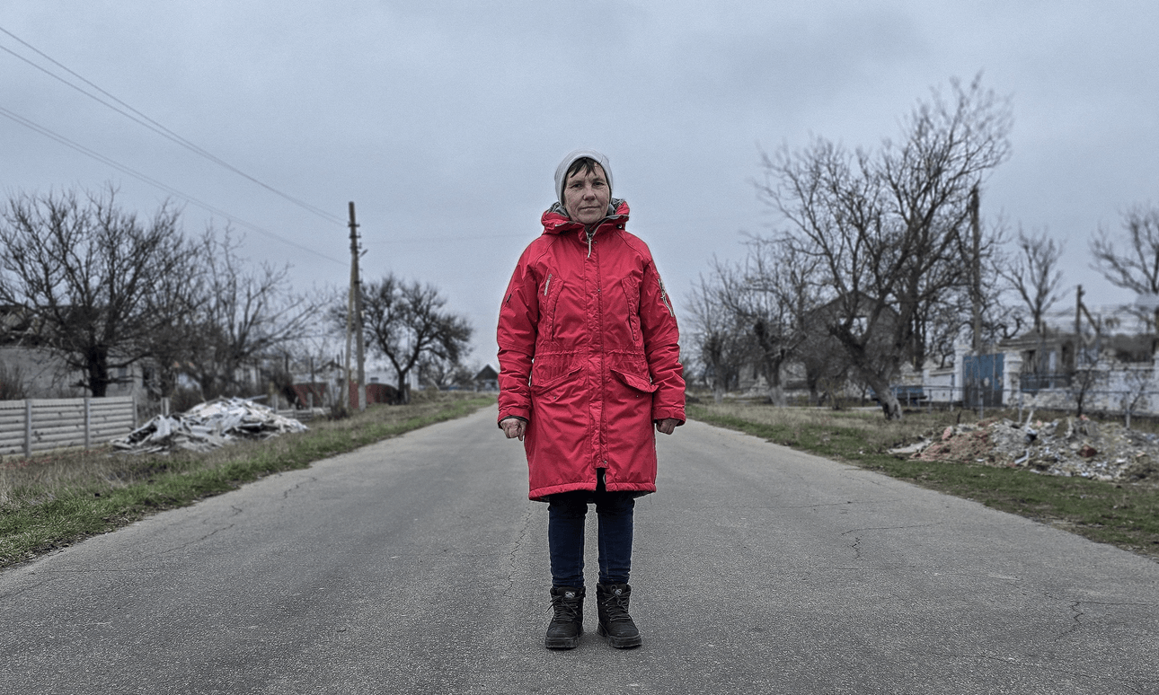 Natasha Zhuravel stands on her empty street. Her neighbours have not returned home.  
