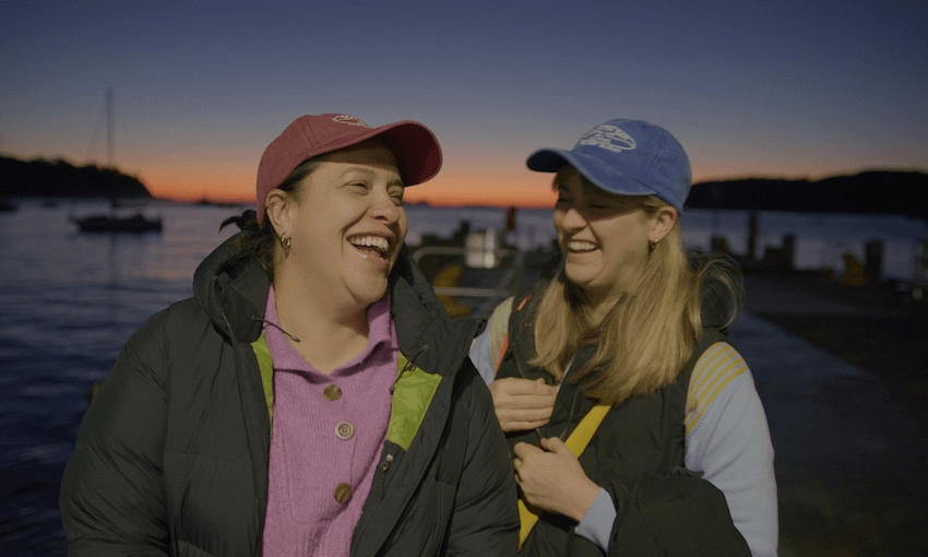 brynley stent and kura forrester laughing at sunset on stewart island