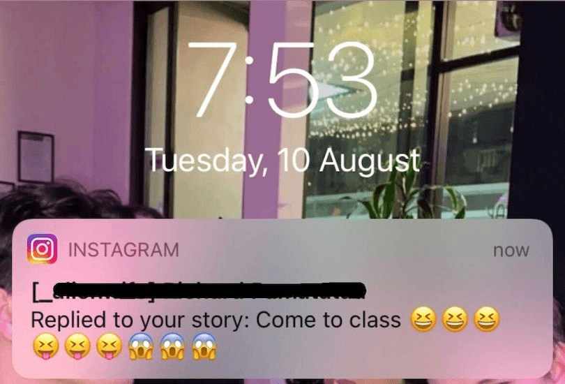A phone lock screen shows the time as 7:53 on Tuesday, 10 August. An Instagram notification covers part of the screen, saying "Replied to your story: Come to class" with various emojis, including laughing, angry, and surprised faces.