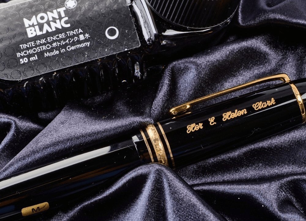 photo of a black pen with gold details