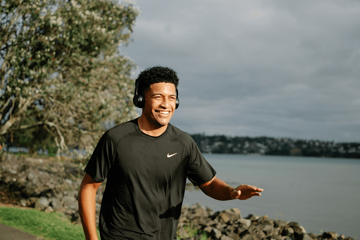 young man running on the waterfront