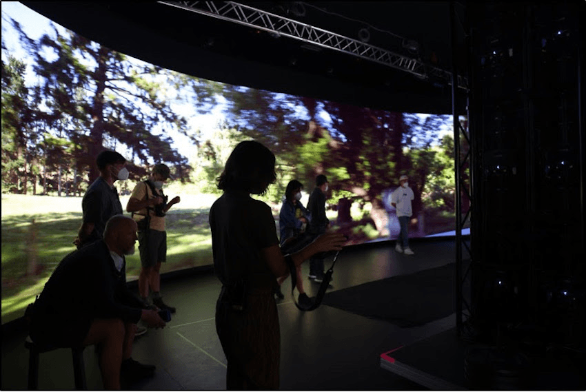 A giant virtual screen in a studio showing the New Zealand countryside