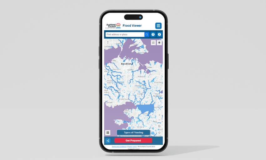 A smartphone displaying the Auckland Council's Flood Viewer map. The map shows highlighted flood-prone areas in purple and white. The screen includes search options and buttons for types of flooding and preparedness.