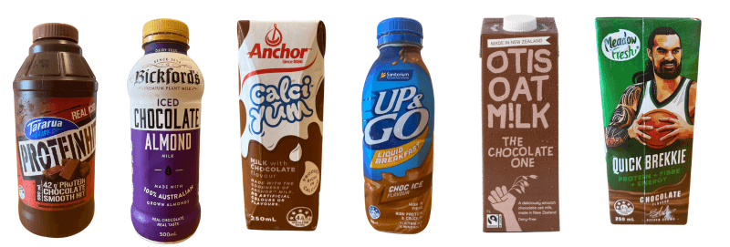 A row of six assorted chocolate milk drinks in various packaging designs, including bottles and cartons, featuring brands like Dare, Bickford's, Anchor, Up&Go, Otis, and Sanitarium.