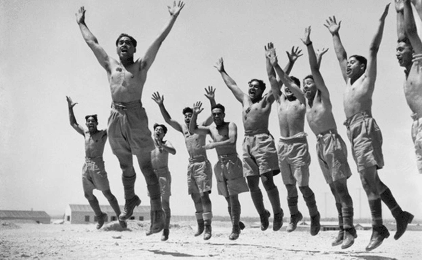 Members of the Māori Battalion performing a haka in Maadi, Egypt. Taken by an unidentified photographer during World War II.