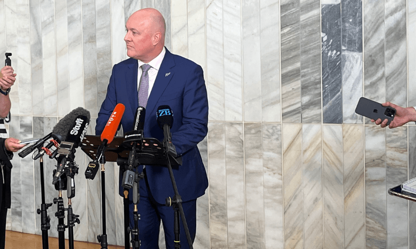 Prime minister Christopher Luxon speaking to reporters in parliament's Banquet Hall.