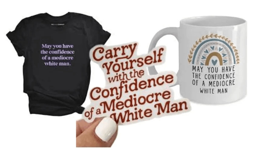 A black T-shirt, a white mug, and a sticker all feature variations of the phrase "May you have the confidence of a mediocre white man." The mug has an added rainbow motif and the sticker has decorative text.