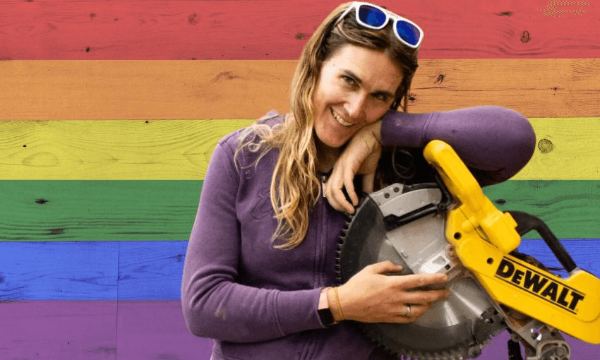 Cahoots founder Jade Musther leans on a drop saw in front of a pride-coloured background