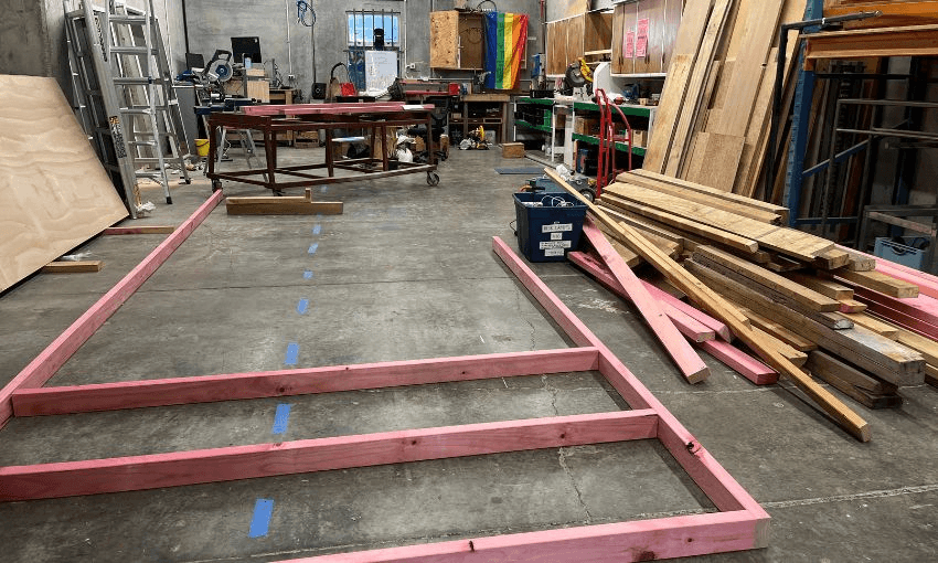 Inside Cahoots workshop, with the half built frame sitting on the concrete floor.