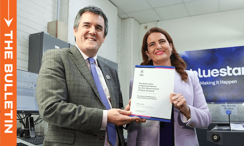 Nicola Willis and Chris Bishop pose with a copy of Budget 2025 at Blue Star printers on Wednesday. (Photo: Hagen Hopkins/Getty Images) 
