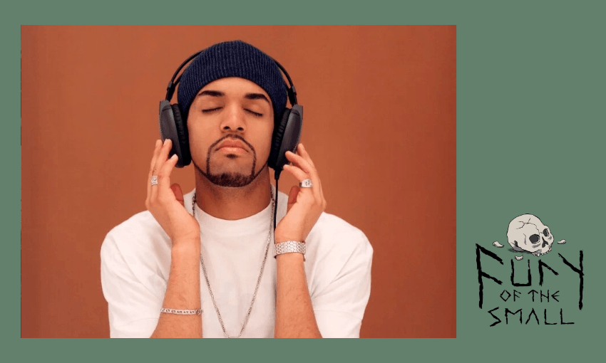 Artist craig david wearing a white t-shirt and headphones alongside the title logo for Fury of the Small with a skull illustration above the text