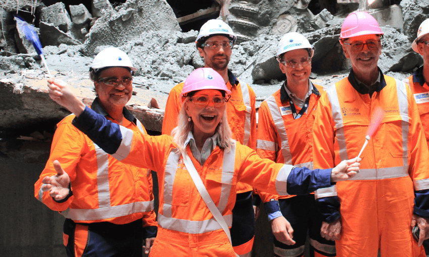 Desley Simpson, Wayne Brown, engineers and the tunnel boring machine at the Central Interceptor breakthrough on March 28 2025. (Photo: Gabi Lardies). 
