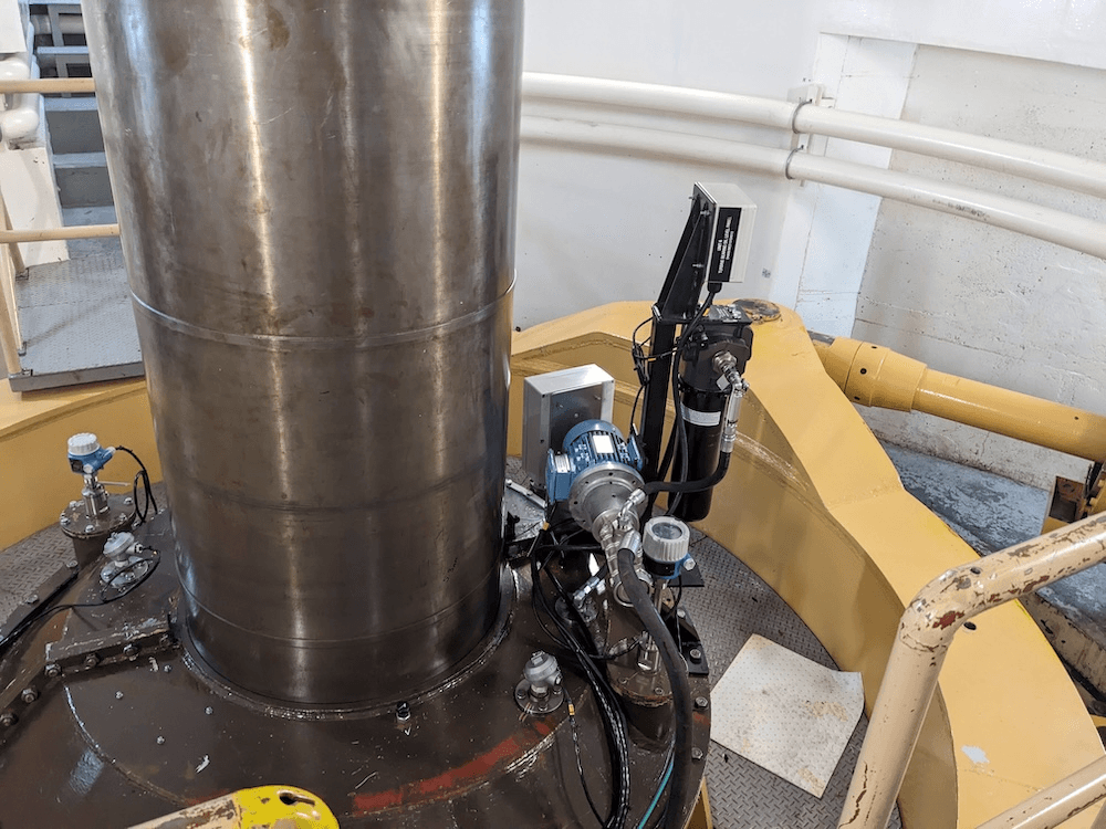 a steel pipe in theh ydro station with hydraulic systems around it to control the water
