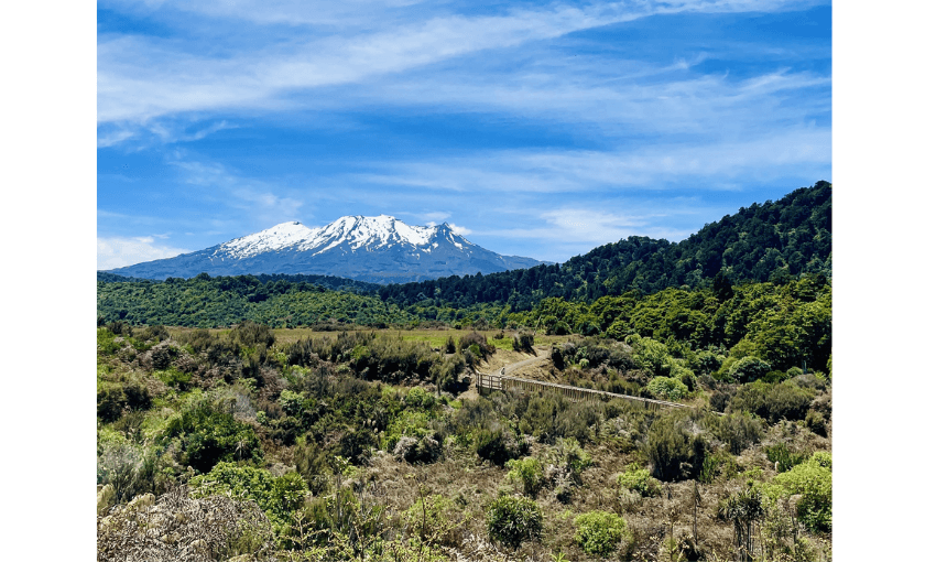 A photograph of Ruapehu. It's a fine day, snow is on the top of the mountain. 