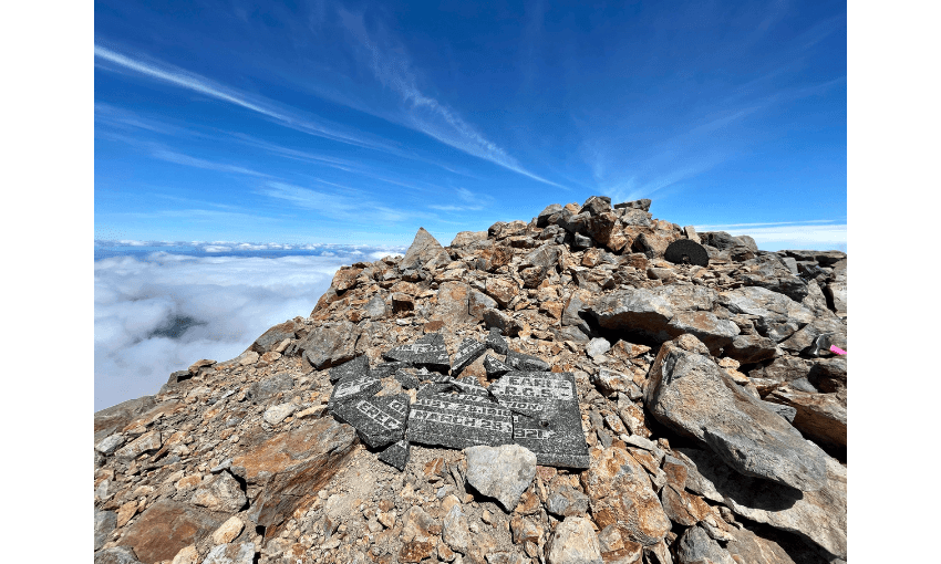 A photograph of the summit of Ruapehu showing a smashed plaque.