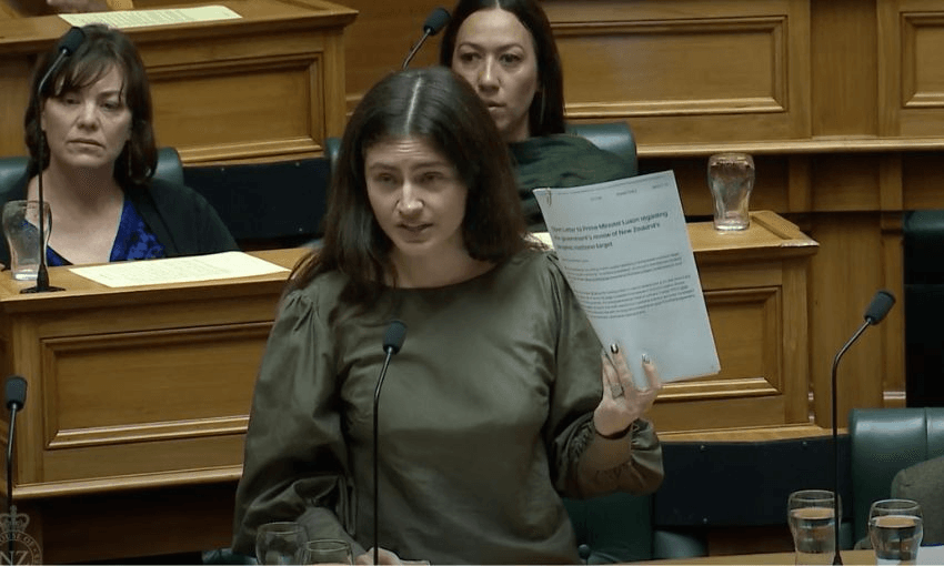 Chlöe Swarbrick, speaking in the House of Representatives, holds an open letter penned by 26 climate scientists to our government.