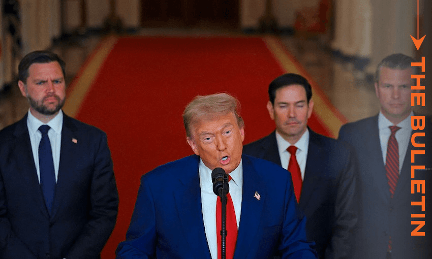 A man in a blue suit speaks at a podium with a microphone, flanked by three men in suits. They stand on a red carpet in an ornate hallway. "THE BULLETIN" text appears vertically on the right.