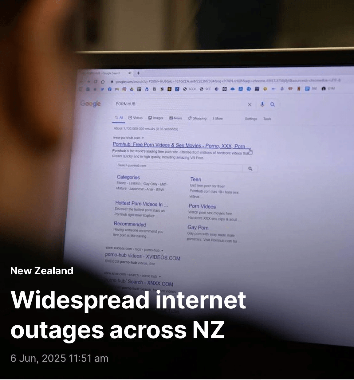 A man Googling PORN HUB alongside the headline 'Widespread internet outages across NZ'