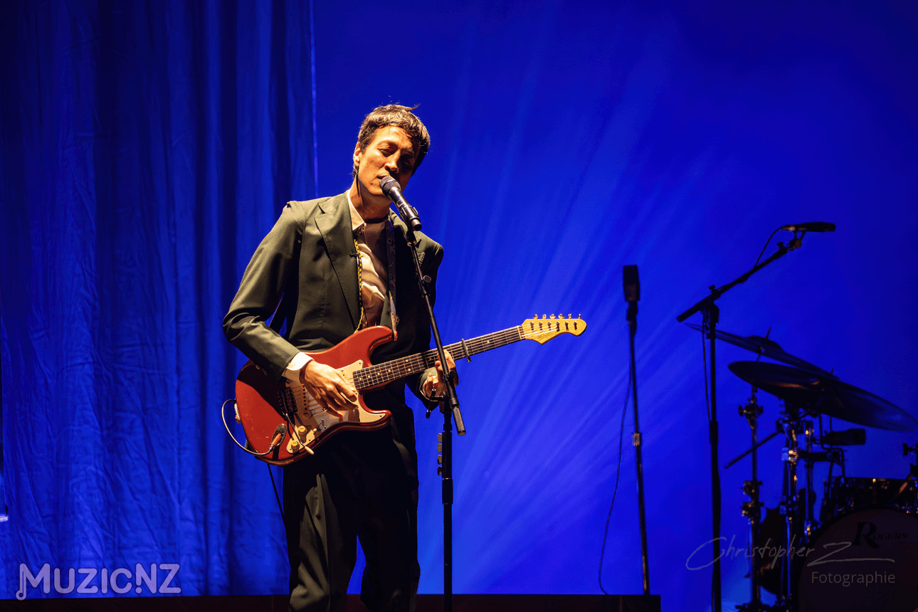 photo of marlon williams playing a red guitar