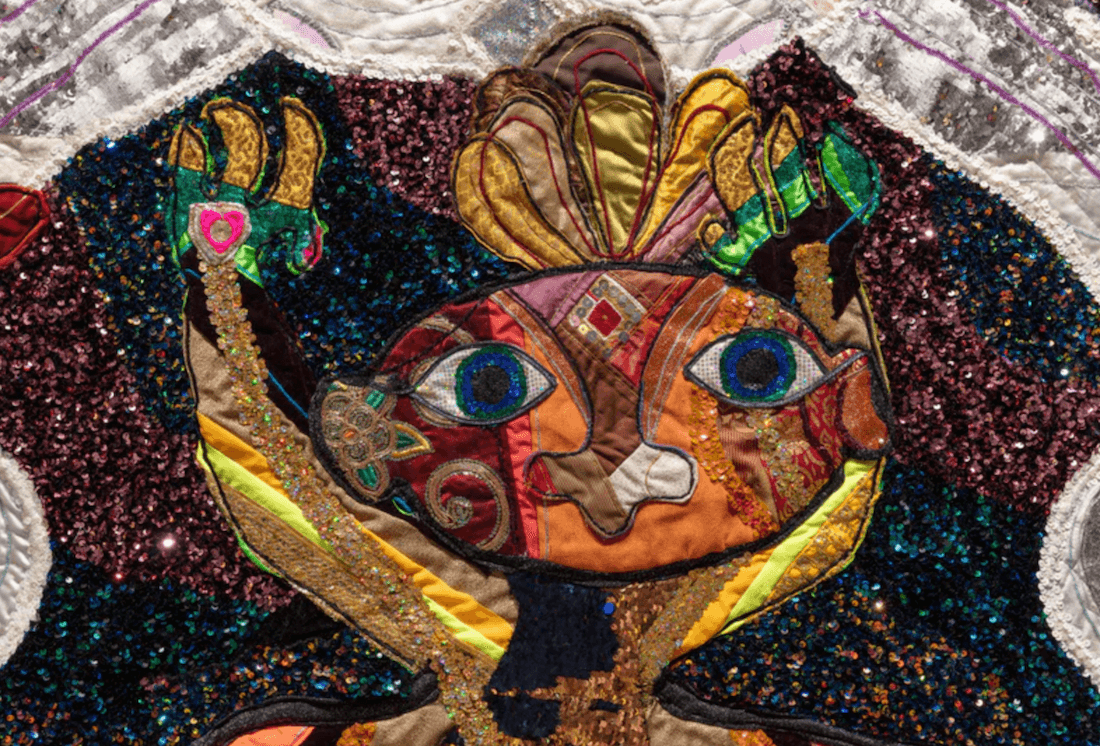 A colourful detailed and sequinned quilt