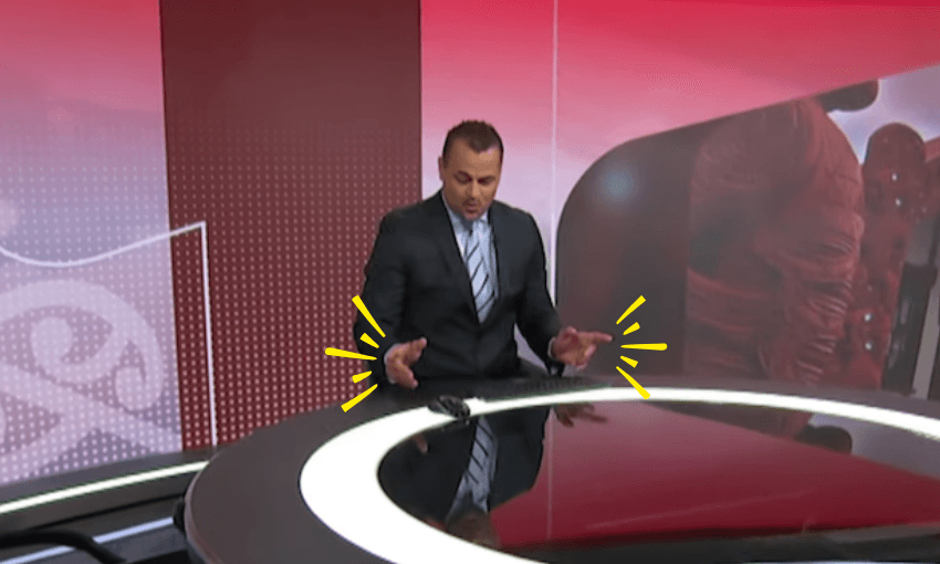 Scotty Morrison sits at the Te Karere news desk and points his fingers as he dances