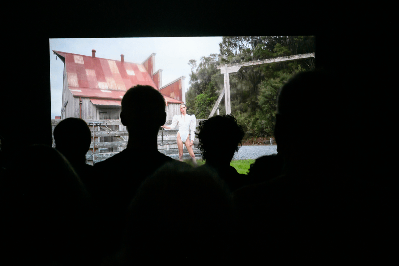 people looking at a barn