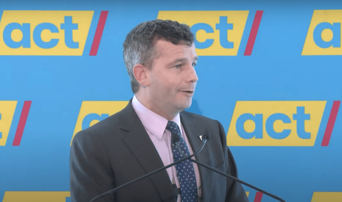 David seymour with act party banner