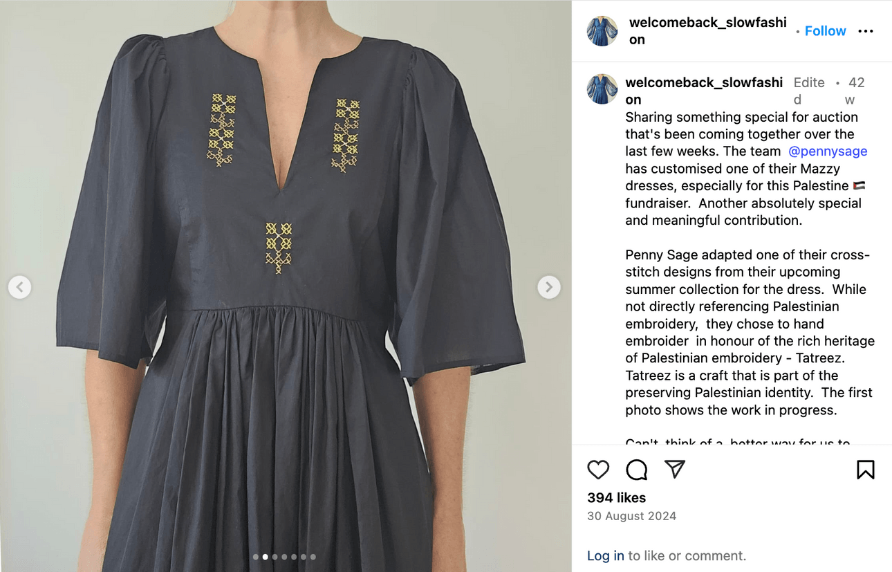 An Instagram post of a black dress with delicate gold embroidery
