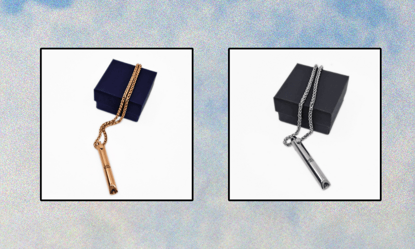 an image of a silver and gold necklace with a whistle-like pendant at the end