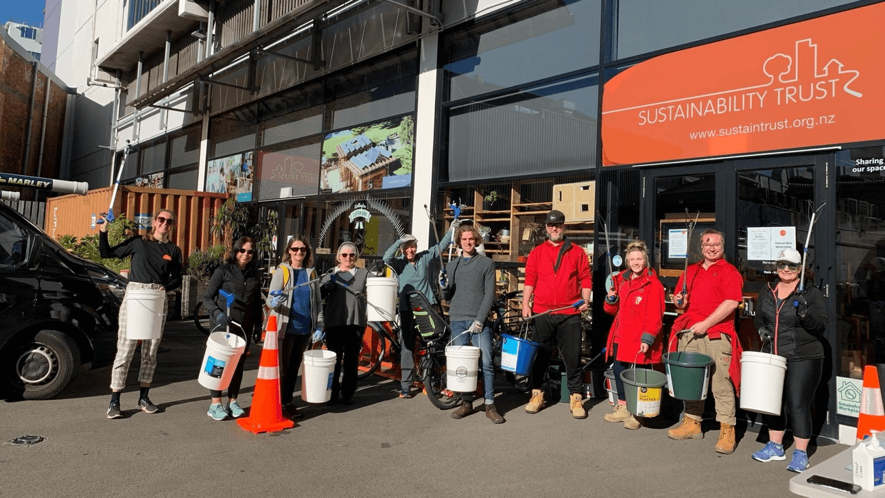group of people with buckets and litter pickers