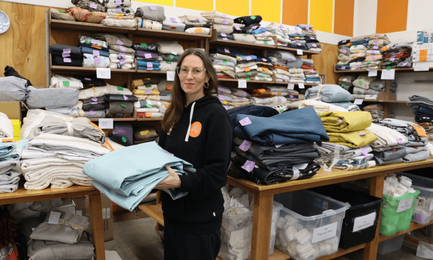 Julie Gunn at Sustainability Trust’s curtain bank in Wellington. (Photo: Emlou Lattimore). 
