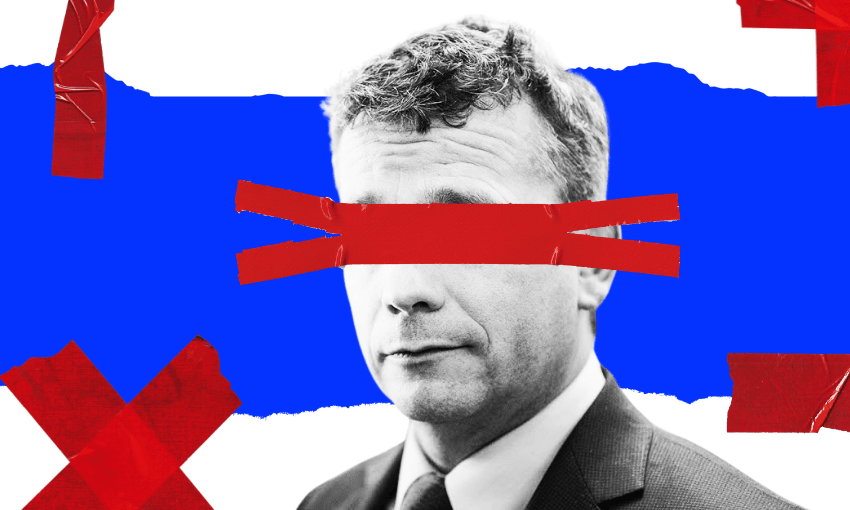 A man in a suit has his eyes covered by red tape. The background features bold blue and white stripes with additional pieces of red tape around the image.