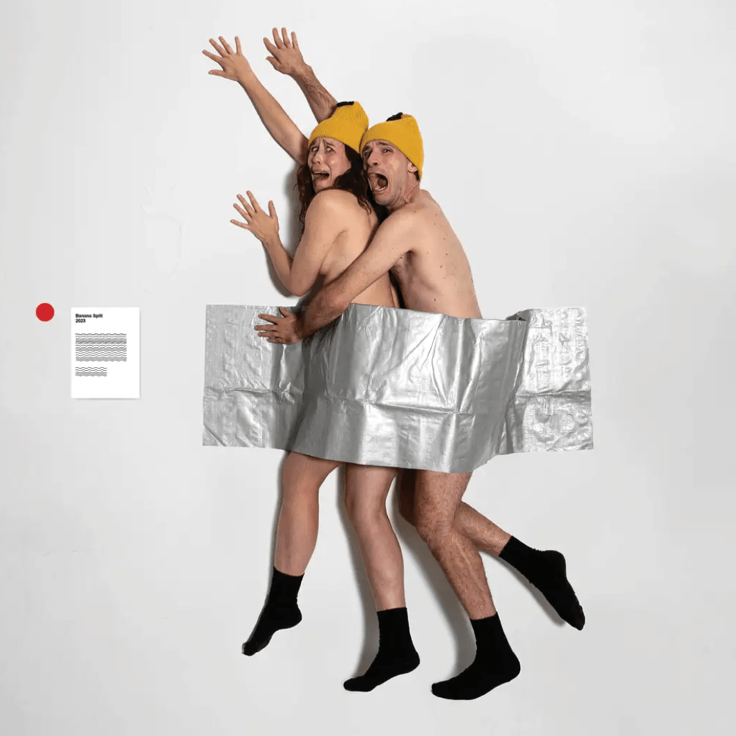 two people ductaped to a wall screaming