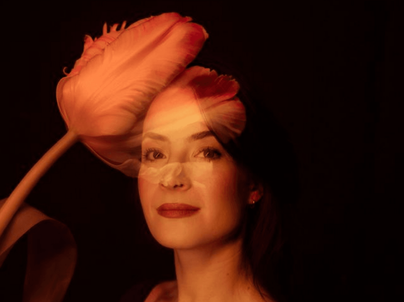 photo of a womans face with a tulip layered over it