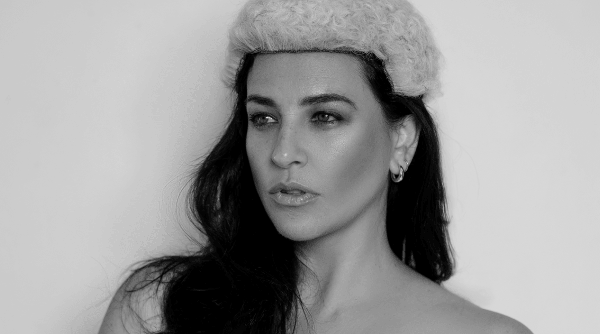 black and white photograph of a woman wearing a judges wig