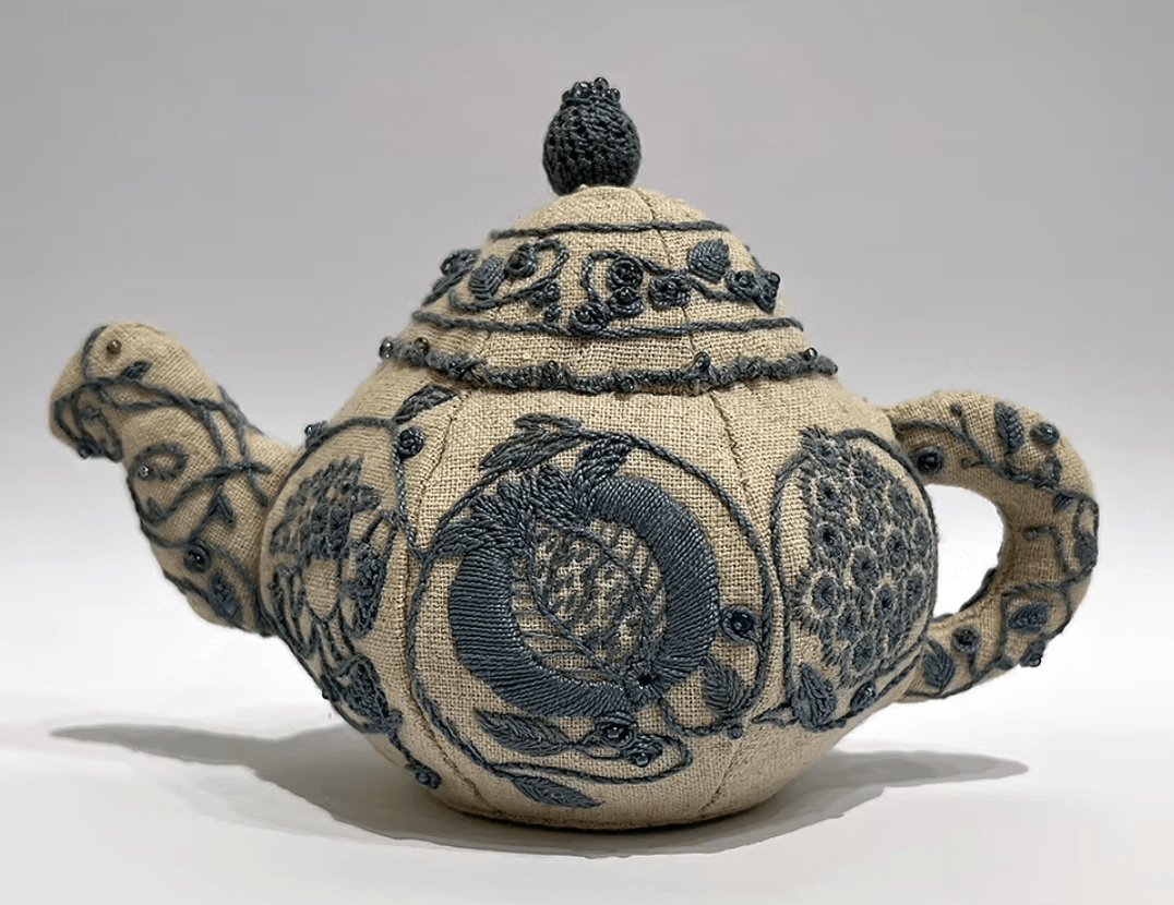 a 3D tea pot made from embroidery and fabric