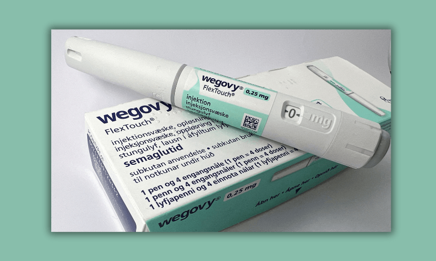 a white pen-shaped medication with green stickering and a green and white medicine box