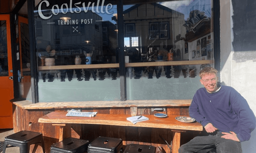 Sam O'Brien pictured sitting outside Coolsville Cafe in Hataitai.