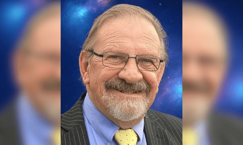 Headshot of Rudi against a galaxy background.