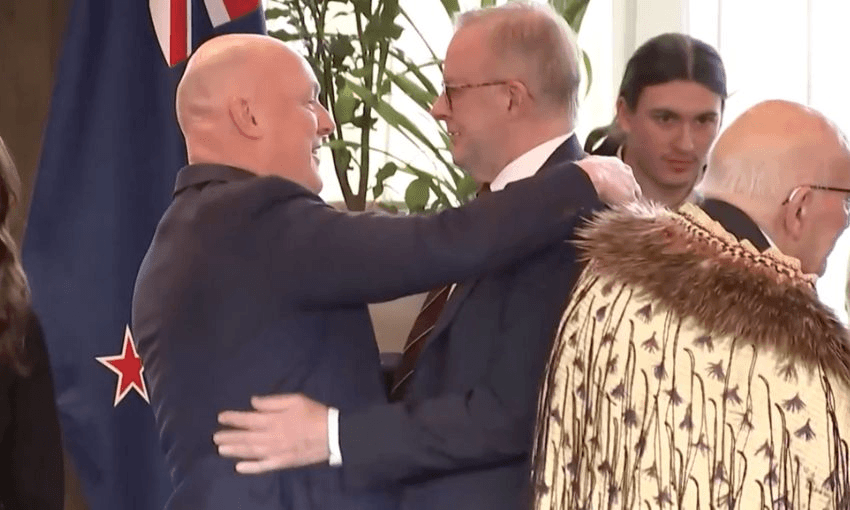 Christopher Luxon and Anthony Albanese awkwardly hold each other after Albanese went in for a hongi, and was rejected.