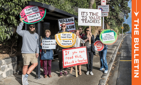 Striking teachers wait for a bus to take them to a rally, August 2018. (Photo by Dave Rowland/Getty Images) 
