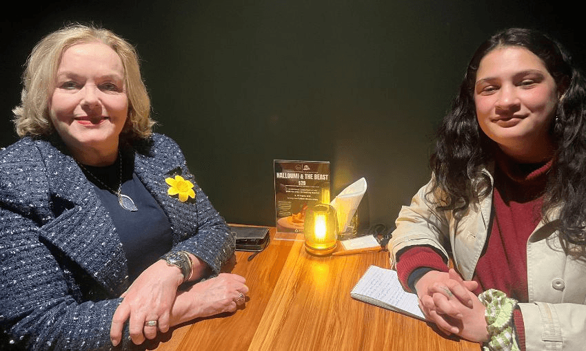 Judith Collins and Lyric Waiwiri-Smith smiling from a table at Pint of Order.