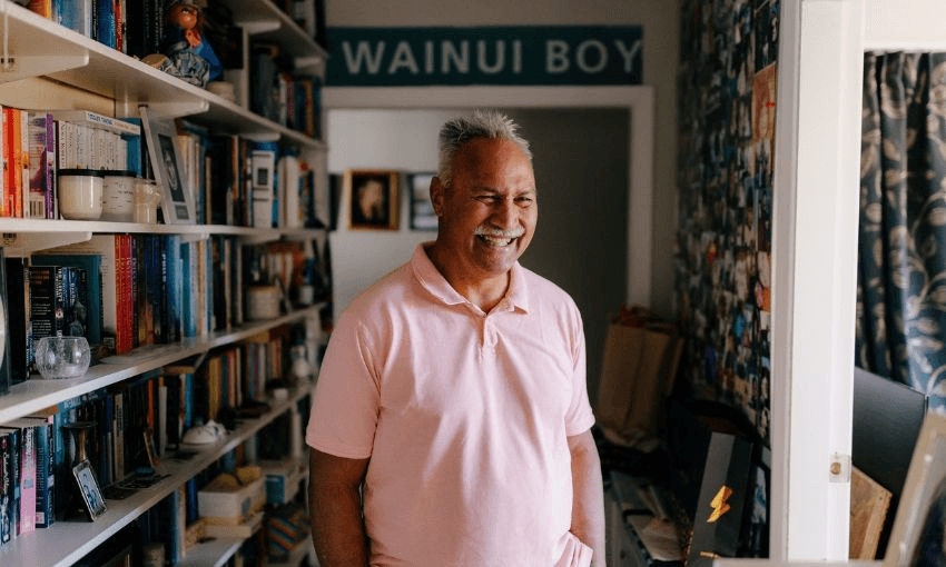 Laban, photographed at home in front of a sign reading "Wainui Boy"
