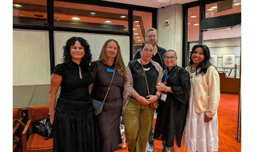 A small group of Pasifika people all smiling. 