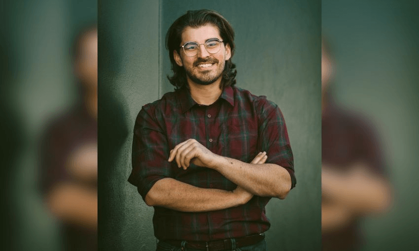 Dave Taylor poses with his arms folded over his chest.